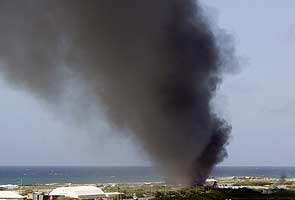 Military plane bursts into flames at Mogadishu airport