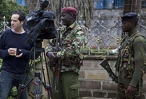 Gunfire at besieged Kenyan mall, Islamists threaten hostages