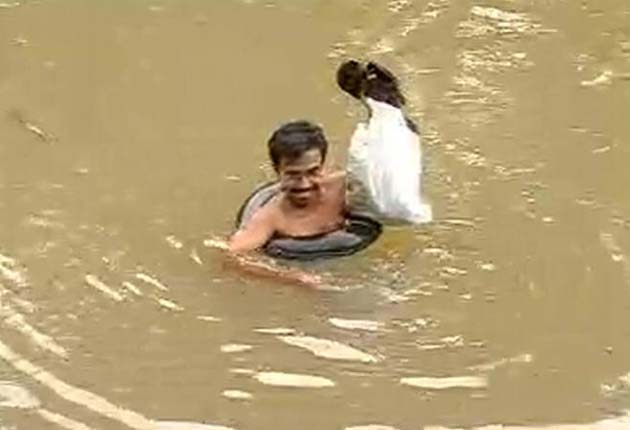 A teacher who swims through a river everyday to get to his students