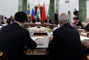BRICS backs Manmohan Singh, warns against US stimulus withdrawal