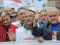 100,000 Poles in anti-govt march, threaten strike