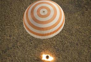 Three space station crew members land after 166-day mission