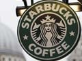 Starbucks says guns unwelcome, though not banned
