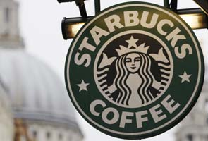 Starbucks says guns unwelcome, though not banned