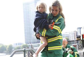 Tourists dive into Thames after London boat fire