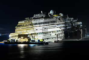 Shipwrecked Costa Concordia declared vertical off Italy