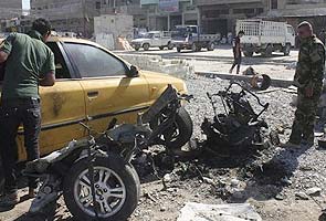 Car bomb blasts s kill 54 people in Baghdad