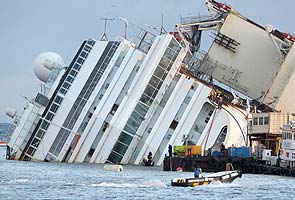 Italian cruise Costa Concordia wreck lifts off rocks in record salvage