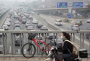 Factory shutdowns, traffic limits as China moves to tame its smog