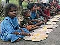 Cyclone Phailin: waiting for relief from government, villagers turn highway into community kitchen