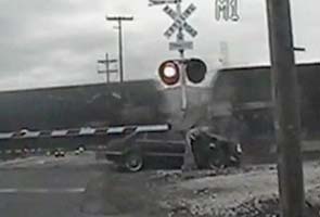 US woman survives after car hit by two trains