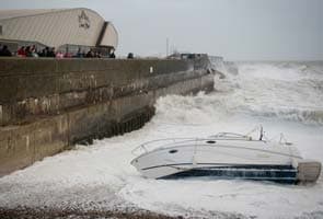 Storm batters southern Britain, hitting flights, trains and power