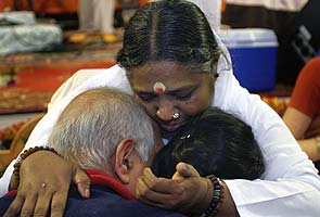 Spiritually-hungry foreigners flock to Kerala's hugging saint 'Amma' in thousands 