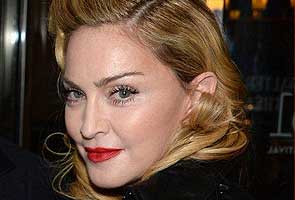 Madonna banned from theater chain after texting during movie