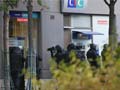 Armed man who held hostages at Paris bank gives up, says French police