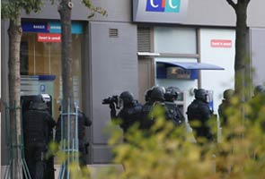 Armed man holds hostages in a Paris bank, say police
