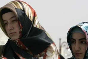 Turkey lifts generations-old ban on Islamic head scarf
