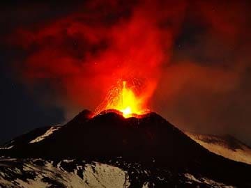 Mount Etna volcano erupts, lighting up sky over Sicily