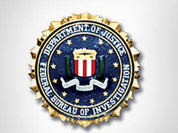 Ex-FBI agent gets eleven years for security leaks, child porn