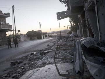 Syria rebel chieftain killed; Bashar Assad forces bomb besieged town