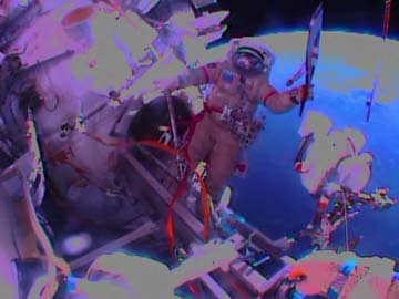 Russians take Olympic torch on historic spacewalk
