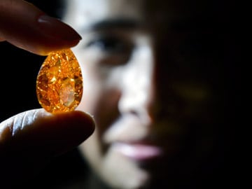 World's largest orange diamond sold for $31.5m in Swiss auction