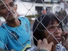 Philippine typhoon survivors beg for help as rescuers struggle