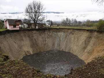 Bosnians panic as sinkhole swallows village pond