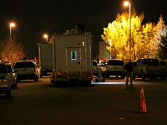 Denver police say two armed men inside empty school