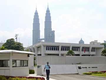 Malaysia summons Singapore envoy over spying report