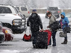 Rain and snow threaten to disrupt US holiday travel