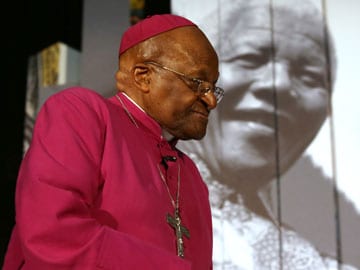 Desmond Tutu reverses course, says will attend Nelson Mandela's burial