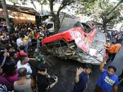 21 dead as bus falls from Manila highway onto van