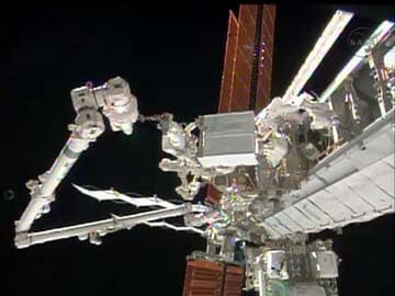 NASA astronauts step out on Christmas Eve spacewalk