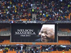 Leaders gather, thousands sing in rain in farewell to Nelson Mandela