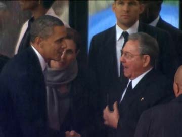 Barack Obama shakes hands with Cuba's Raul Castro at Nelson Mandela memorial