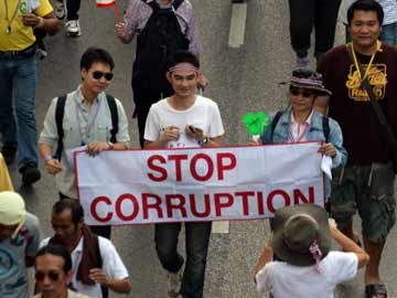 Thai PM calls elections as 100,000 join protests Bangkok