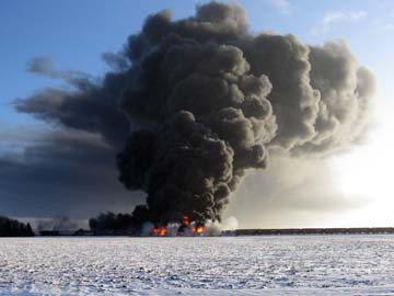 Train collision in North Dakota sets oil rail cars ablaze