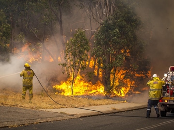 Australian wildfire razes 46 homes, one man dead