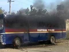 Protesting villagers clash with cops in Hisar, two police buses set on fire