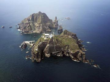 Japan revises teaching manuals, says islands its territory