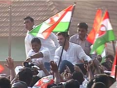 Rahul Gandhi sits on top of police vehicle, sparks controversy