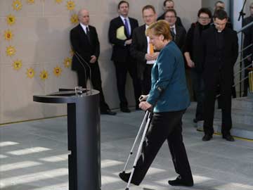 Angela Merkel makes first appearance on crutches after ski fall