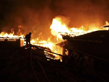 Night fire destroys ancient Tibetan town in China