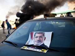 Former Egyptian President Mohamed Morsi's trial delayed to February 1 after court absence