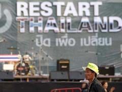 Thai protesters target ministries, threaten bourse