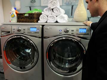 Naked man gets stuck in washing machine