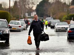 Britain's River Thames on flood alert as blame game rages