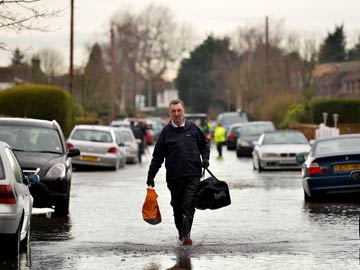 Britain's River Thames on flood alert as blame game rages 