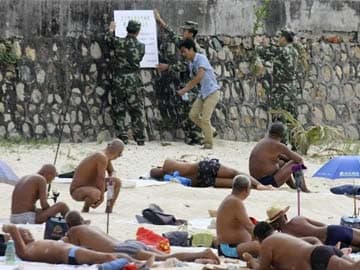 Chinese cover-up: Resort island cracks down on nude sunbathing  